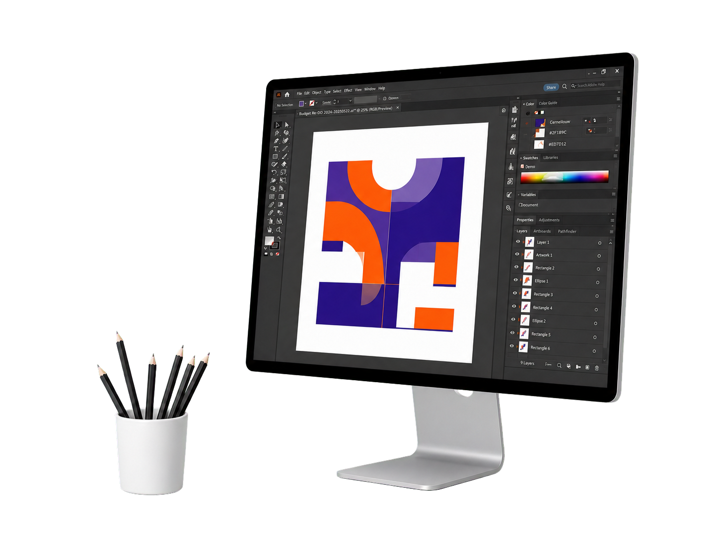 Graphic design workstation with a monitor and drawing pencils